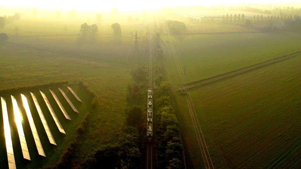 Train and solar energy plant.